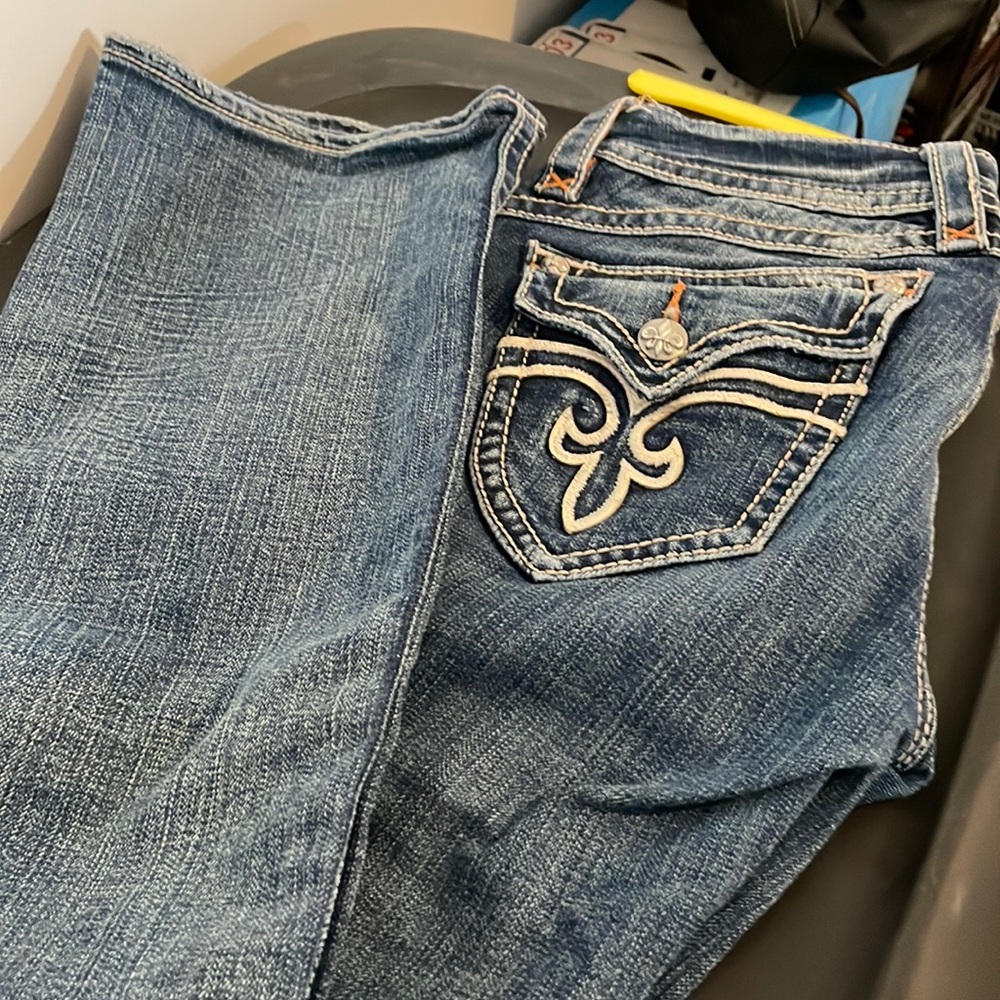 COPY - Rock Revival women’s boot cut jeans with flap pockets and white logo.